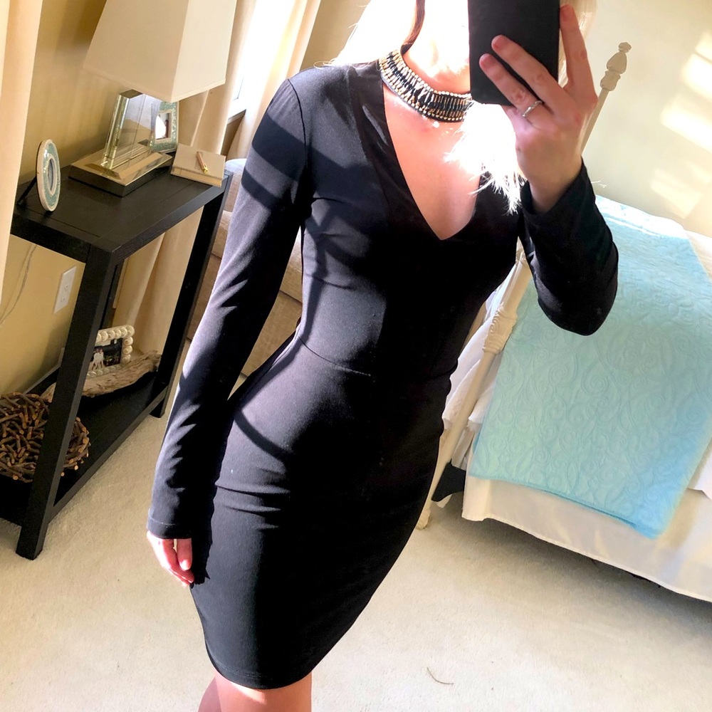 Black cocktail dress with beaded neck detail